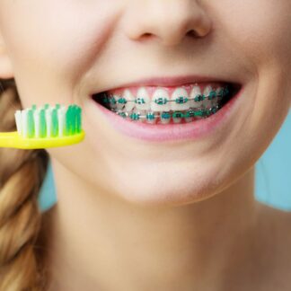 Close up of brushing teeth with braces