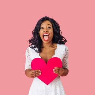 Happy woman up against pink background